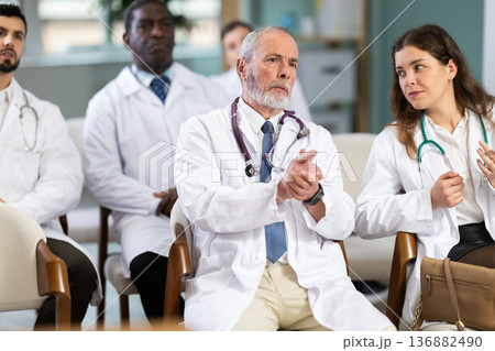 Doctors of different ages at the conference 136882490