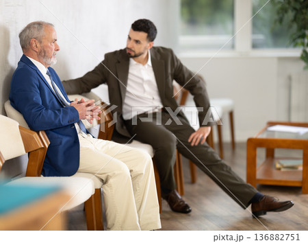 Mature man talking to company manager 136882751