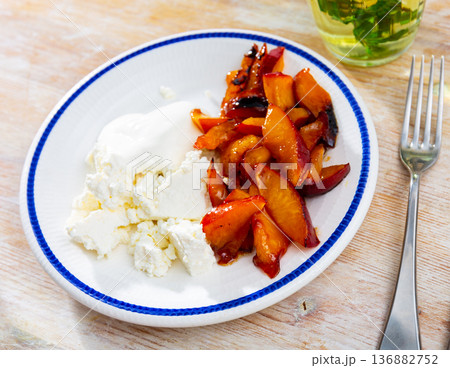 Cottage cheese served with peaches Cottage cheese served with peaches 136882752