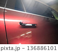 Extended handle on a modern car.  136886101