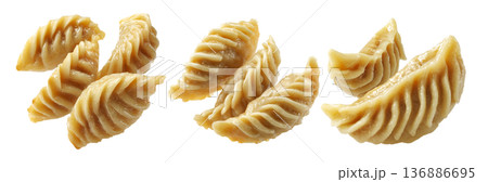 Set of Steamed Banana dumplings with intricate twisted edges, isolated on white background. Concept of Asian cuisine and food art Set of Steamed Banana dumplings with intricate twisted edges, isolated on white background. Concept of Asian cuisine and food art 136886695