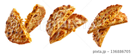 Chickpea flatbread with crispy golden brown texture and cut slices isolated on white background. Concept of Argentina Faina food 136886705