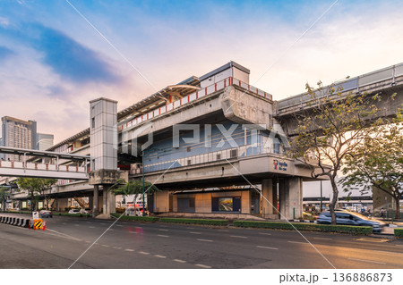 View of the Mo Chit BTS Skytrain station structure over Phahonyothin Road during the late afternoon in the Chatuchak district View of the Mo Chit BTS Skytrain station structure over Phahonyothin Road during the late afternoon in the Chatuchak district 136886873