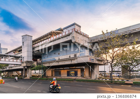 View of the Mo Chit BTS Skytrain station structure over Phahonyothin Road during the late afternoon in the Chatuchak district View of the Mo Chit BTS Skytrain station structure over Phahonyothin Road during the late afternoon in the Chatuchak district 136886874