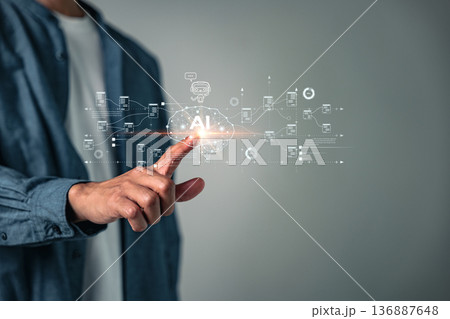 Touching the virtual AI brain represents digital technology system development, innovation and strategy for analyzing business, showcasing future digital transformation using advanced AI software 136887648