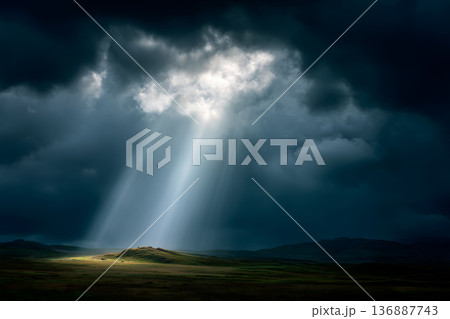 Field of grass with a bright sun shining through the clouds Field of grass with a bright sun shining through the clouds 136887743
