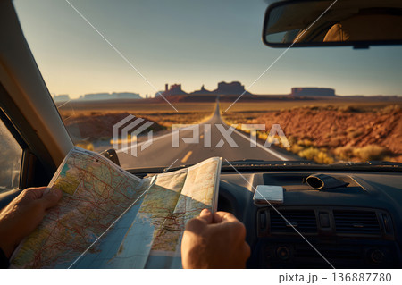Person is looking at a map in a car Person is looking at a map in a car 136887780