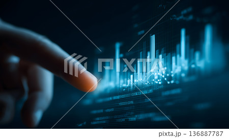 Finger is pointing at a graph with a lot of numbers Finger is pointing at a graph with a lot of numbers 136887787