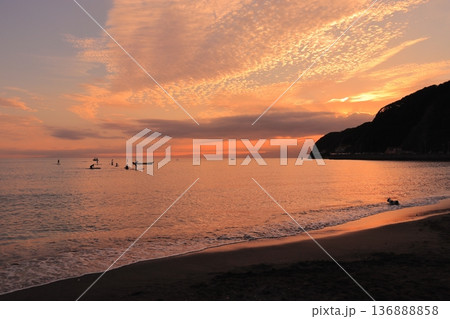 Beautiful sunset over the calm sea with SUP 136888858