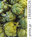Pile of fresh green artichokes close-up texture background natural organic vegetables 136889226
