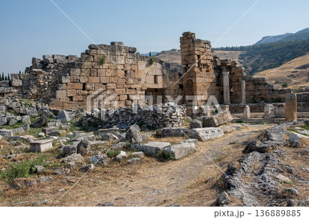 Exploring Ancient Ruins of Pamukkale During a Sunny Afternoon With Clear Skies and Breathtaking Landscapes Exploring Ancient Ruins of Pamukkale During a Sunny Afternoon With Clear Skies and Breathtaking Landscapes 136889885