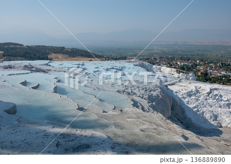 Pamukkales Stunning Terraces and Mineral-Rich Thermal Pools Create a Breathtaking Landscape in Turkeys Natural Wonder at Midday 136889890