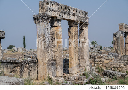 Discover the Ancient Ruins of Pamukkale Featuring Striking Columns and Remnants of Historical Architecture Surrounded by Beautiful Nature Discover the Ancient Ruins of Pamukkale Featuring Striking Columns and Remnants of Historical Architecture Surrounded by Beautiful Nature 136889903