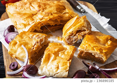 Greek savory sliced meat bougatsa pie with olives Greek savory sliced meat bougatsa pie with olives 136890185