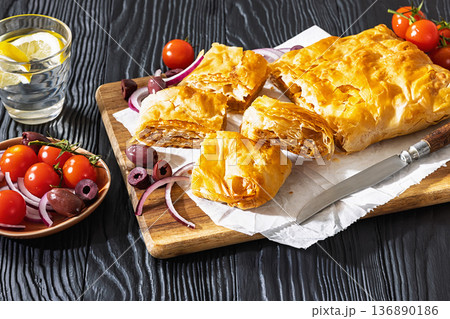 Greek savory sliced meat bougatsa pie with olives Greek savory sliced meat bougatsa pie with olives 136890186