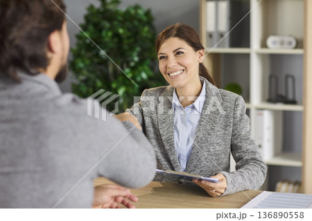 Handshake on job interview of recruiter and vacancy candidate in business office 136890558