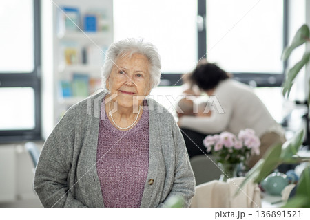Smiling elderly woman looking at camera. 136891521
