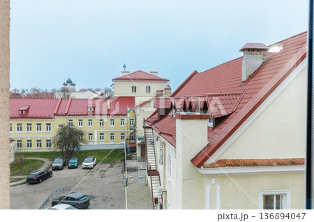 European Urban Courtyard with Red Tiled Roofs and Historical Buildings 136894047