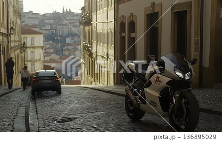 Sportbike parked on cobblestone street with distant cityscape vi 136895029