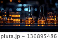Golden Liquid in Laboratory Flasks with Bokeh Background, Reflec 136895486