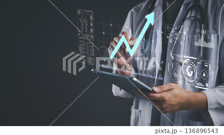 Doctor using tablet analyze patient data on virtual screen. Medical technology shows health data analytics, growth chart success. Healthcare innovation for future diagnosis and treatment concept. Doctor using tablet analyze patient data on virtual screen. Medical technology shows health data analytics, growth chart success. Healthcare innovation for future diagnosis and treatment concept. 136896543