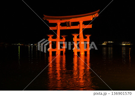 Itsukushima Shrine torii illuminated at night on Miyajima island Itsukushima Shrine torii illuminated at night on Miyajima island 136901570