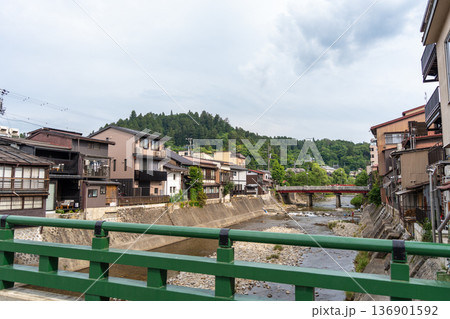 Miyagawa River flowing through traditional houses in Takayama, Japan 136901592