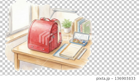 桌上放著一個書包和一套第二天要使用的學習用品。 136903833