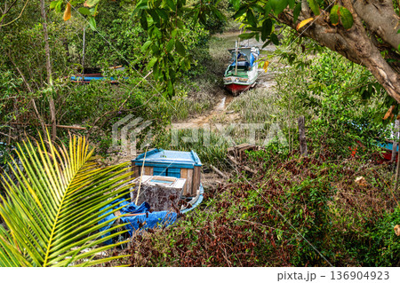 Soure, Brazil - Dec 10, 2025: Boats in a dried-up river at Soure, Ilha de Marajo, Para, Brazil Soure, Brazil - Dec 10, 2025: Boats in a dried-up river at Soure, Ilha de Marajo, Para, Brazil 136904923