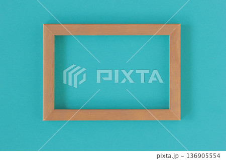 Teal Color Background. Wood frame mockup on teal background with empty space for poster, presentation layout. Concept of teal color 2026 trend for design marketing, wall template 136905554