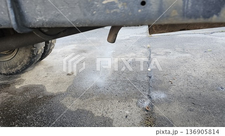 Exhaust smoke pavement exhaust gases from the muffler of the car, poisoning the environment Exhaust smoke pavement exhaust gases from the muffler of the car, poisoning the environment 136905814