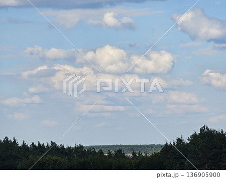 Cloudy sky landscape Sky background texture.Looking up blue sky and white clouds at summer day.Bottom-up view of beautiful sky.Stretch ceiling sky photo. 136905900