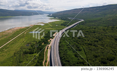 Drone shot The M6 motorway Nakhon Ratchasima Province - Bang Pa-in Lam Ta Khong River and Mountain. Motorway Korat Thailand Drone shot The M6 motorway Nakhon Ratchasima Province - Bang Pa-in Lam Ta Khong River and Mountain. Motorway Korat Thailand 136906245