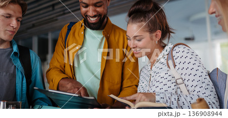 Young university friends hanging out between lectures. 136908944
