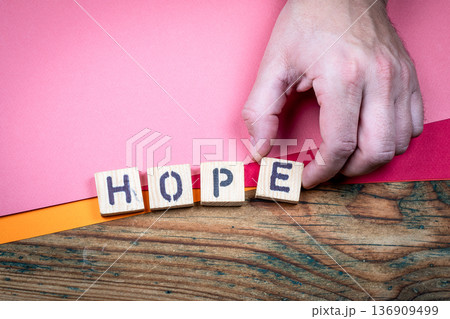 HOPE Positive Outlook And Resilience Concept Shown With Wooden Letter Blocks HOPE Positive Outlook And Resilience Concept Shown With Wooden Letter Blocks 136909499