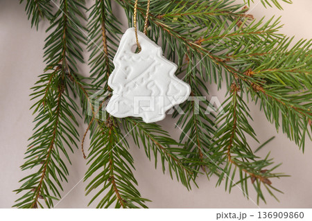 Group of air dry clay handmade Christmas decor on beige background. Children air dry clay activity handicraft idea. Preparing for Christmas holiday decorating. Modern organic design minimalistic Group of air dry clay handmade Christmas decor on beige background. Children air dry clay activity handicraft idea. Preparing for Christmas holiday decorating. Modern organic design minimalistic 136909860