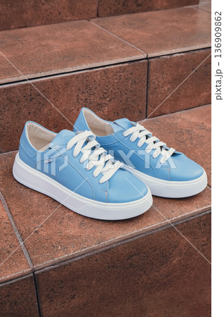 Elegant blue leather womens shoes blank product for branding displayed. New casual female sneakers no-brand footwear e-commerce. No logo product unbranded fashion Elegant blue leather womens shoes blank product for branding displayed. New casual female sneakers no-brand footwear e-commerce. No logo product unbranded fashion 136909862