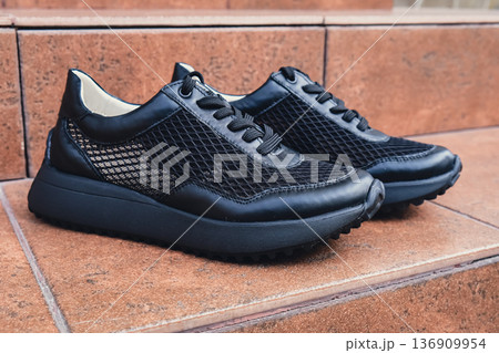 Elegant black leather womens shoes blank product for branding displayed. New casual female sneakers no-brand footwear e-commerce. No logo product Elegant black leather womens shoes blank product for branding displayed. New casual female sneakers no-brand footwear e-commerce. No logo product 136909954