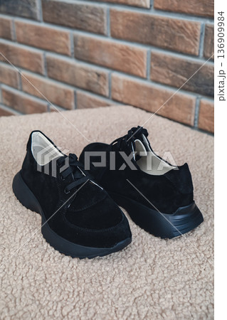 Elegant black leather womens shoes blank product for branding displayed. New casual female sneakers no-brand footwear e-commerce. No logo product Elegant black leather womens shoes blank product for branding displayed. New casual female sneakers no-brand footwear e-commerce. No logo product 136909984