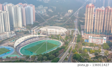 Tseung Kwan O Sports Ground surrounded by dense residential towers Feb 21 2026 136911427