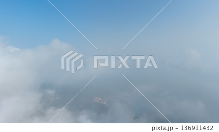 Soft White Clouds And Clear Blue Sky With Misty Atmospheric Horizon Soft White Clouds And Clear Blue Sky With Misty Atmospheric Horizon 136911432