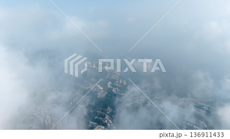 Soft White Clouds And Clear Blue Sky With Misty Atmospheric Horizon Soft White Clouds And Clear Blue Sky With Misty Atmospheric Horizon 136911433