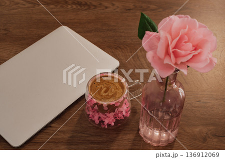 morning work routine: fresh coffee and beautiful rose decorating the start of a digital day 136912069