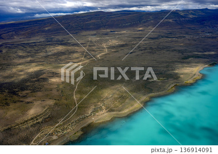 el calafate argentinian turquoise lake and Patagonia desert view from aerial from airplane window el calafate argentinian turquoise lake and Patagonia desert view from aerial from airplane window 136914091
