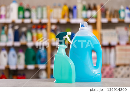 Bottles of cleaning liquid in foreground Bottles of cleaning liquid in foreground 136914200