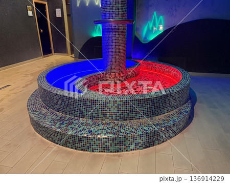 Illuminated kneipp pool with mosaic tiles and contrasting water zones. Hydrotherapy ritual, circulation stimulation and modern wellness interior Illuminated kneipp pool with mosaic tiles and contrasting water zones. Hydrotherapy ritual, circulation stimulation and modern wellness interior 136914229