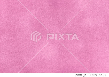 Pink suede fabric background with matte nap velvet texture. Light purple tones and soft felt textile surface in macro Pink suede fabric background with matte nap velvet texture. Light purple tones and soft felt textile surface in macro 136914495