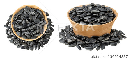 Sunflower seeds in wooden bowl isolated on white background. Top view. Flat lay Sunflower seeds in wooden bowl isolated on white background. Top view. Flat lay 136914887