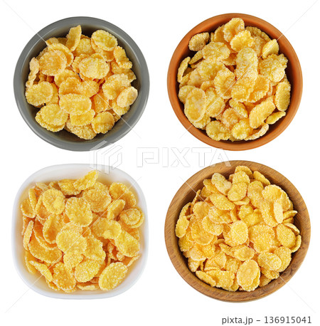 Cornflakes in ceramic and wooden bowl isolated on white background. Top view. Flat lay 136915041