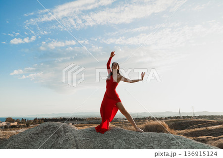 Dynamic movement of woman in red in nature Calabria region Dynamic movement of woman in red in nature Calabria region 136915124